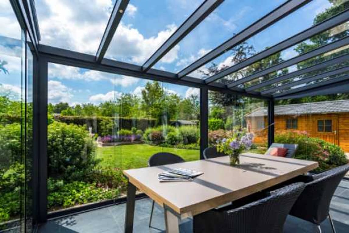 Aluminium veranda with glass sliding door and glass roof